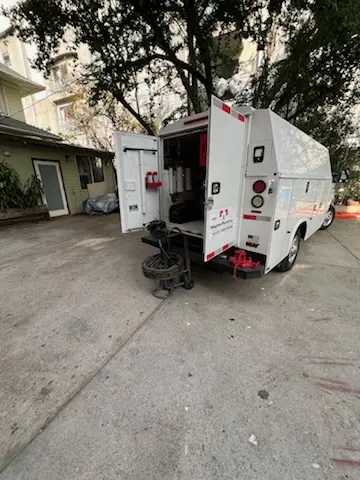 Magnet Plumbing service vehicle on-site for Grease Trap Cleaning in Sims